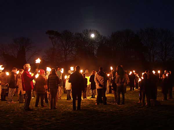 Congregation by Moon and Torchlight