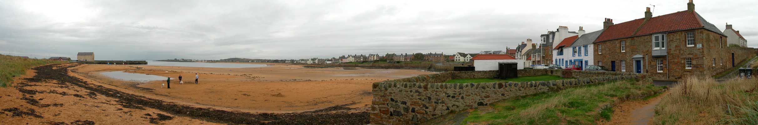Orange sand dominates the beach and harbour